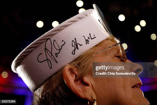 Ruthmary Pearce of Annville, Pennsylvania, wears a sailors hat with Alaska Governor Sarah Palin's signature during a rally with Republican...