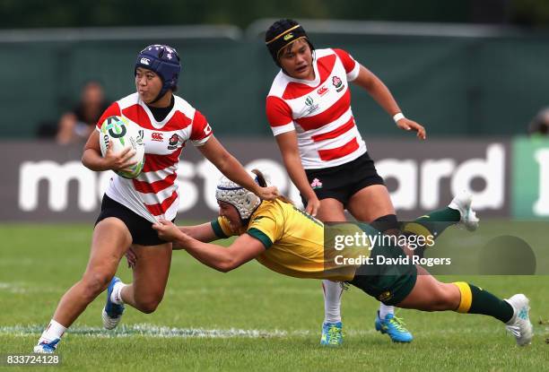 Mayu Shimizu of Japan is tackled by Sharni Williams of Australia during the Women's Rugby World Cup Pool C match between Australia and Japan at...