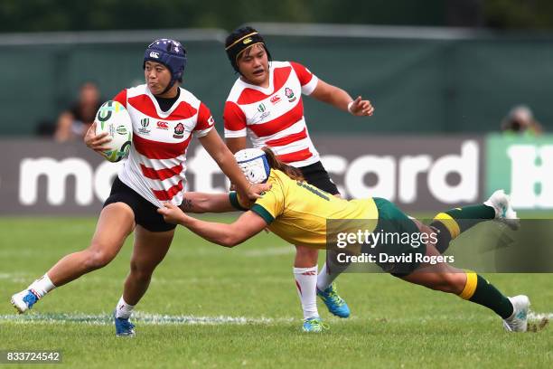 Mayu Shimizu of Japan is tackled by Sharni Williams of Australia during the Women's Rugby World Cup Pool C match between Australia and Japan at...