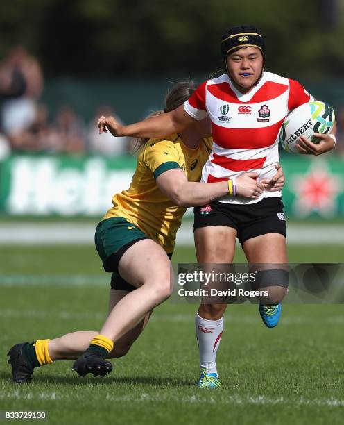 Riho Kurogi of Japan is chased down and tackled by Samantha Treherne of Australia during the Women's Rugby World Cup Pool C match between Australia...