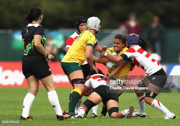Katrina Barker of Australia is tackled during the Women's Rugby World Cup Pool C match between Australia and Japan at Billings Park UCD on August 17,...