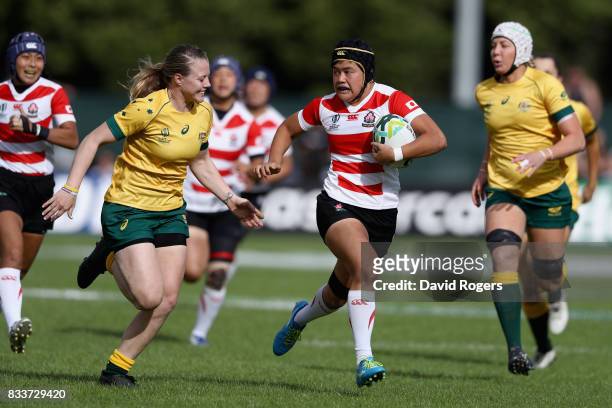 Riho Kurogi of Japan is chased down and tackled by Samantha Treherne of Australia during the Women's Rugby World Cup Pool C match between Australia...