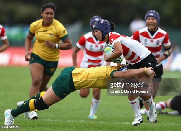 Sayaka Sazuki of Japan is tackled by Sharni Williams of Australia during the Women's Rugby World Cup Pool C match between Australia and Japan at...