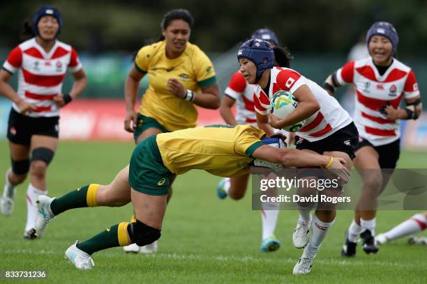 Sayaka Sazuki of Japan is tackled by Sharni Williams of Australia during the Women's Rugby World Cup Pool C match between Australia and Japan at...