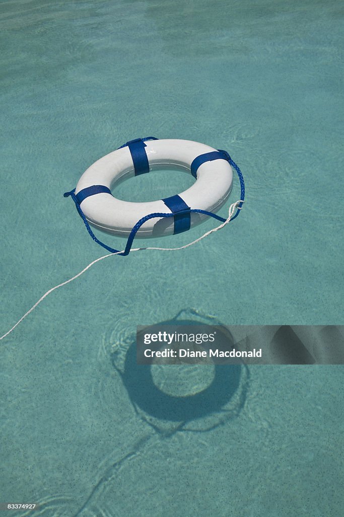 A life ring floating in a swimmimg pool
