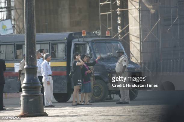 Mumbai Terror Attack: Relatives of hostages inquiring with the police outside Taj Hotel.