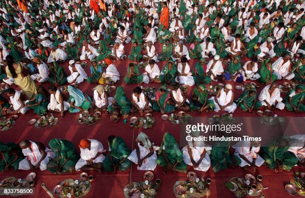 Hindu tribal couples who converted to Christianity a decade ago take an oath on Sunday not to abandon their original religion at a ceremony conducted...