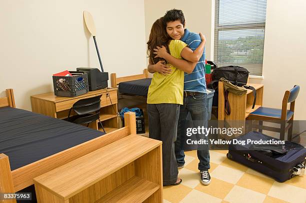 college student hugging his mom goodbye - boy hug stock pictures, royalty-free photos & images