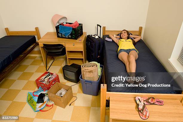 college student moving into dorm room - dorm room stock-fotos und bilder