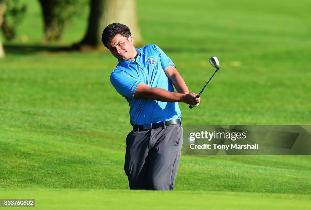 James Keitch of Wells Golf Club chips on to the 18th green during the Golfbreaks.com PGA Fourball Championship - Day 2 at Whittlebury Park Golf &...