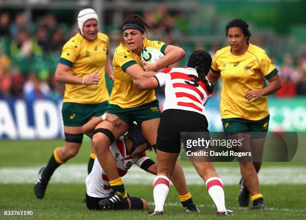 Millie Boyle of Australia is tackled during the Women's Rugby World Cup Pool C match between Australia and Japan at Billings Park UCD on August 17,...