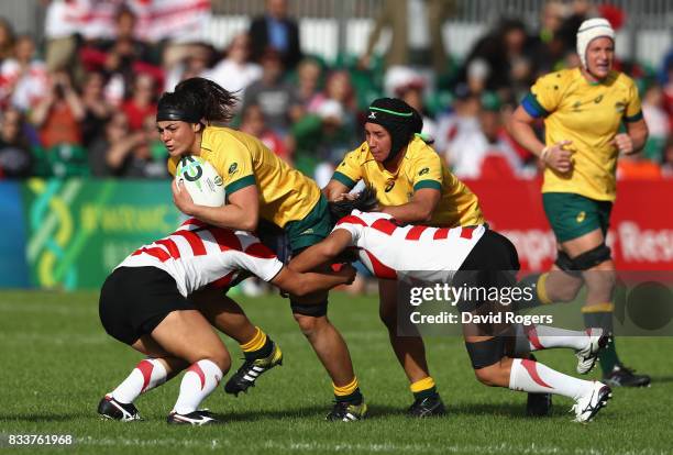 Millie Boyle of Australia is tackled during the Women's Rugby World Cup Pool C match between Australia and Japan at Billings Park UCD on August 17,...