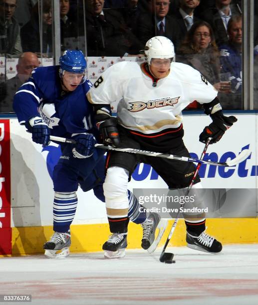 Teemu Selanne of the Anaheim Ducks battles for the puck with Jiri Tlusty of the Toronto Maple Leafs during their NHL game at the Air Canada Centre...