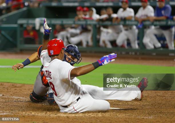 Juan Centeno of the Houston Astros tags out Adrian Beltre of the Texas Rangers in the fifth inning at home at Globe Life Park in Arlington on August...