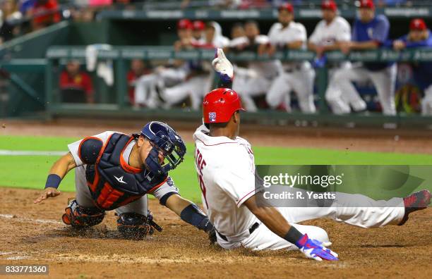 Juan Centeno of the Houston Astros tags out Adrian Beltre of the Texas Rangers in the fifth inning at home at Globe Life Park in Arlington on August...