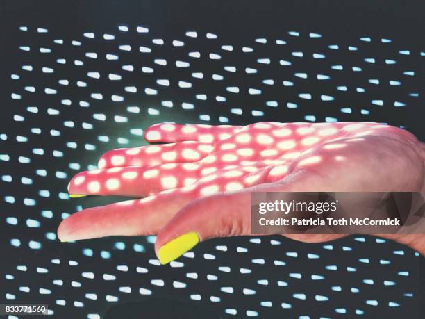 human hand with dotted lighting effect - biological immortality stock pictures, royalty-free photos & images