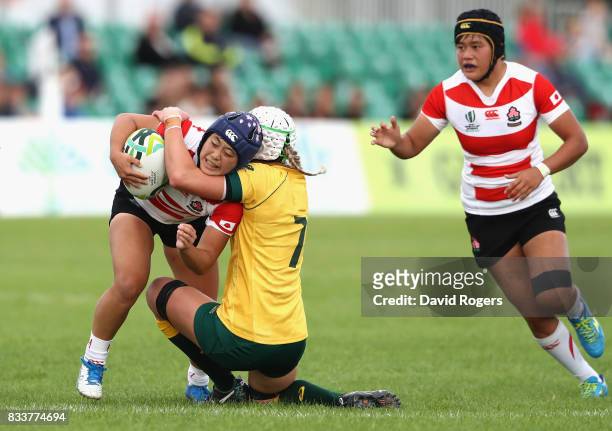 Mayu Shimizu of Japan is tackled by Chloe Butler of Australia during the Women's Rugby World Cup Pool C match between Australia and Japan at Billings...