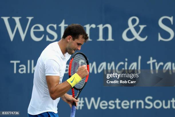 Grigor Dimitrov of Bulgaria celebrates after winning a point against Juan Martin Del Potro of Argentina during Day 6 of the Western and Southern Open...