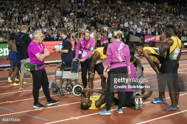16th IAAF World Championships: Jamaica Usain Bolt down on track with injury during Men's 4X100M Final race at Olympic Stadium. Final race of Bolt's...