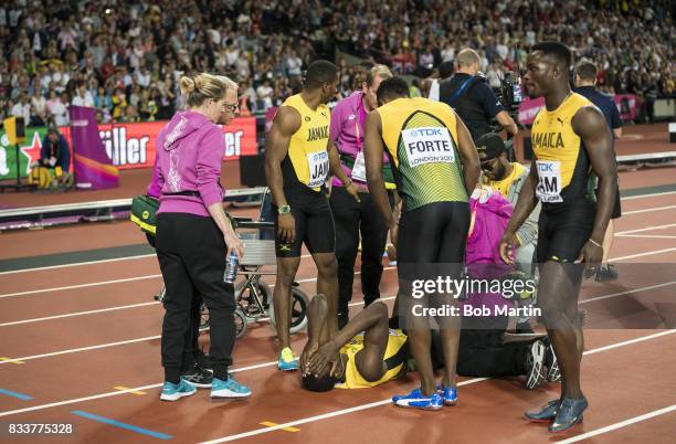 16th IAAF World Championships: Jamaica Usain Bolt down on track with injury during Men's 4X100M Final race at Olympic Stadium. Final race of Bolt's...