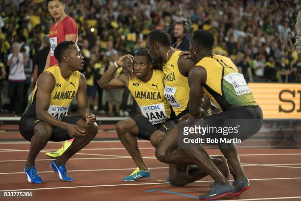 16th IAAF World Championships: Jamaica Usain Bolt with teammates during injury during Men's 4X100M Final race at Olympic Stadium. Final race of...