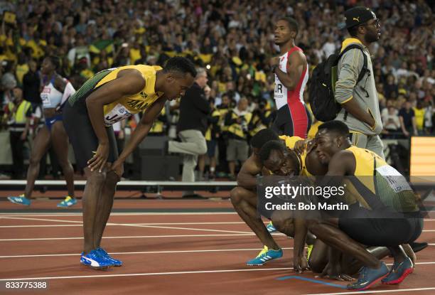 16th IAAF World Championships: Jamaica Usain Bolt with teammates during injury during Men's 4X100M Final race at Olympic Stadium. Final race of...