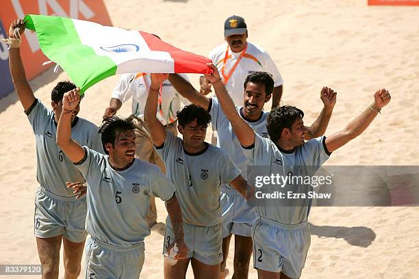 India celebrates beating Pakistan to win the gold medal in beach kabaddi on day five of the 2008 Asian Beach Games at Nusa Dua Beach on October 22,...