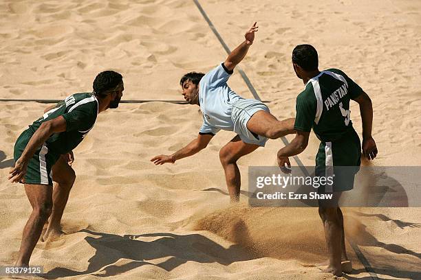 Anup Kumar of India tries to use his feet to tag Pakistan during their beach kabaddi match on day five of the 2008 Asian Beach Games at Nusa Dua...