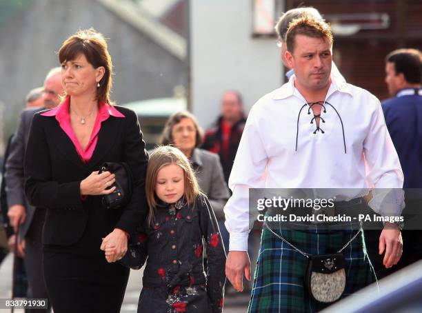 Colin McRae's brother Stuart McRae is pictured with Alison McRae and her daughter Holliew, as they arrive for the Service of Celebration for her...