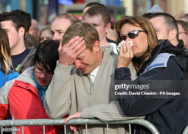 Fans cry during the Service of Celebration for rally driver Colin McRae and his son Johnny McRae taking place at St Nicholas Church, High Street in...