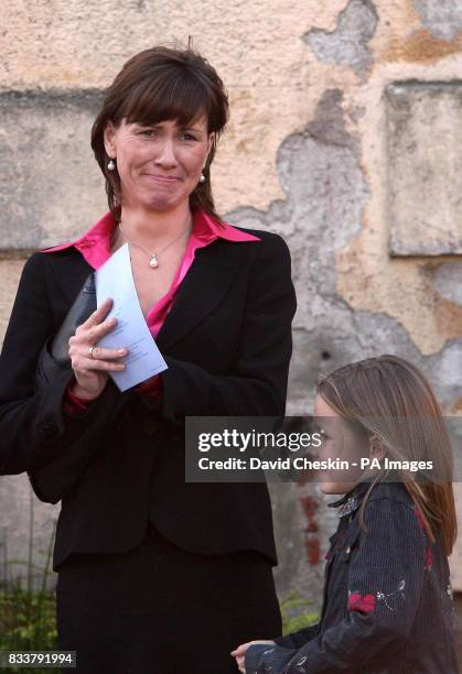 Alison McRae and her daughter Hollie are seen at the Service of Celebration for her husband Colin McRae and their son Johnny McRae taking place at St...