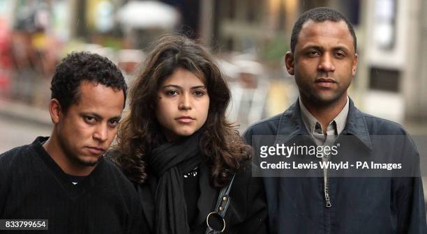 Cousin Alessandro Pereira, cousin Vivian Figueiredo, and family friend Elora Ronaldo da Silva outside the Old Bailey, London, where the Metropolitan...