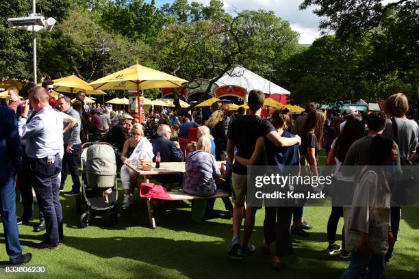 Fringe-goers enjoy the sunshine in the Assembly Gardens, one of the off-street venues for the Edinburgh Festival Fringe, on August 17, 2017 in...