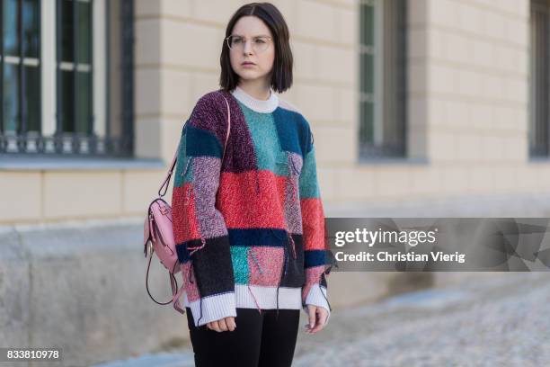 Maria Barteczko wearing patchwork oversized wool sweater Stella McCartney, black skinny jeans Madewell, red buckle boots with studs Givenchy, silver...