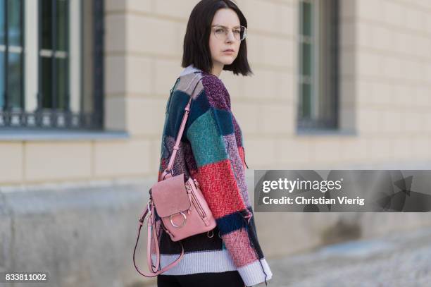 Maria Barteczko wearing patchwork oversized wool sweater Stella McCartney, black skinny jeans Madewell, red buckle boots with studs Givenchy, silver...