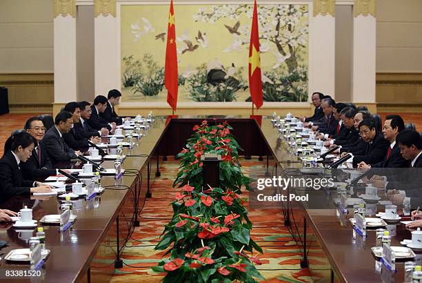 Vietnamese Prime Minister Nguyen Tan Dung , and Chinese President Hu Jintao lead their delegations during a meeting at the Great Hall of the People...