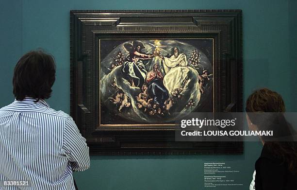 Vistors look at a painting of Domenicos Theotokopoulos, known as El Greco, "The Coronation of the Virgin" , is displayed at the Athens National...
