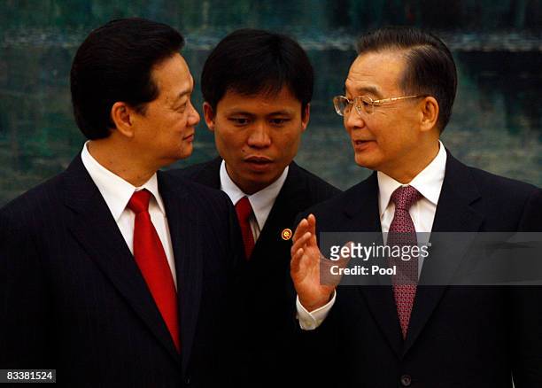 Vietnamese Prime Minister Nguyen Tan Dung , and Chinese President Hu Jintao speak through a translator during a signing ceremony at the Great Hall of...