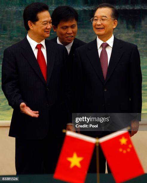 Vietnamese Prime Minister Nguyen Tan Dung , and Chinese President Hu Jintao smile as they speak through a translator during a signing ceremony at the...