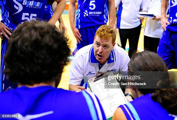 Spirit coach Rob Beveridge talks to his players during three quarter time in the round six NBL match between the Townsville Crocodiles and the Sydney...