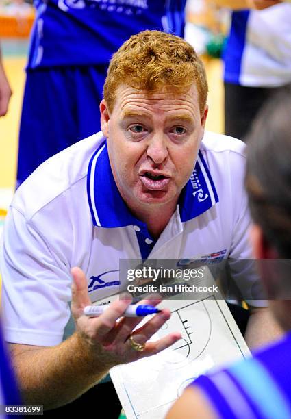 Spirit Coach Rob Beveridge talks to his players during three quarter time in the round six NBL match between the Townsville Crocodiles and the Sydney...