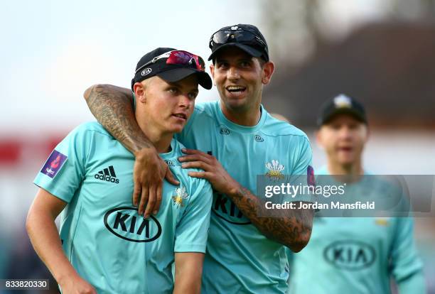 Jade Dernbach and Sam Curran of Surrey walk off the field during the NatWest T20 Blast match between Surrey and Gloucestershire at The Kia Oval on...