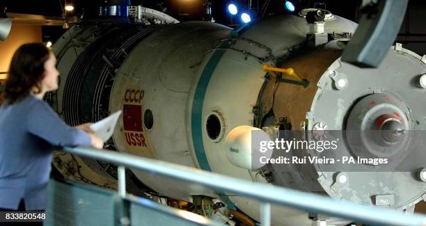 Visitor at the National Space Centre, Leicester, looks at a Russian 1960 Soyuz capsule.