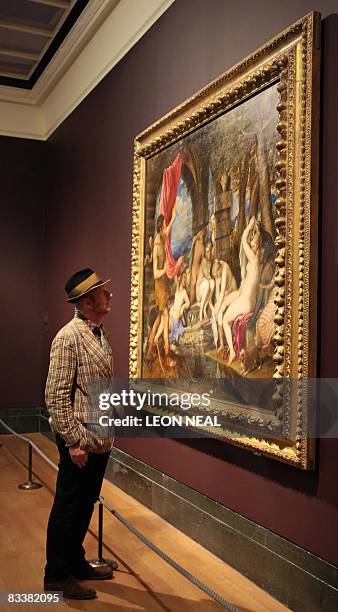 British artist Bob & Roberta Smith looks at a painting entitled "Diana and Actaeon" by artist Titian at the National Gallery in London, on October...