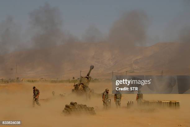 Picture taken on August 17 during a tour guided by the Lebanese army, shows soldiers firing towards jihadist militants from recently captured...