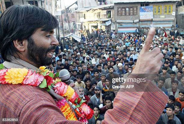 Chairman of the Jammu and Kashmir Liberation Front Mohammad Yasin Malik addresses a crowd during an anti-election rally in Hajan, some 37 kms north...