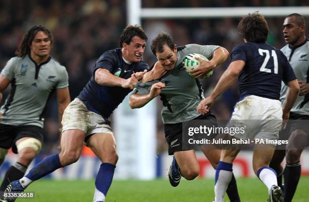 New Zealand's Andrew Hore battles his way through the French defence.