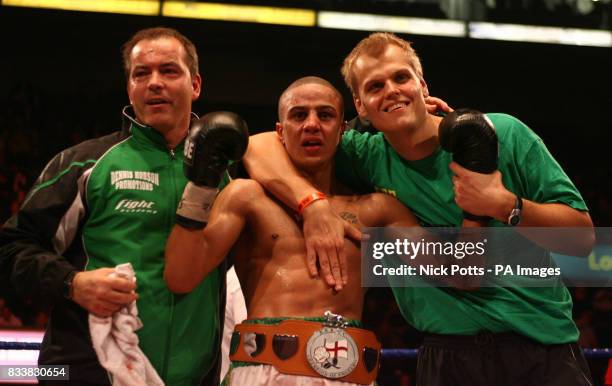 Femi Fehintola celebrates his points victory over Stephen Bell with Manager Denis Hobson . The Vacant Super-Featherweight Championship of England
