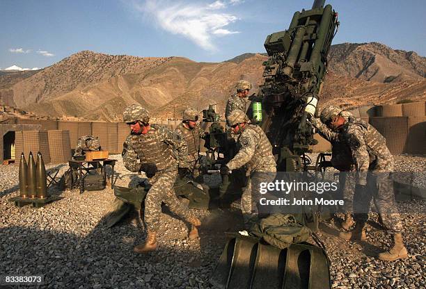 Artillerymen prepare to fire a 155mm Howlitzer at Taliban positions October 22, 2008 near Camp Blessing in the Kunar Province of eastern Afghanistan....