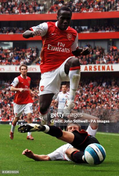 Arsenal's Bacary Sagna leaps over Sunderland's Paul McShane during the Barclays Premier League match at Emirates Stadium, London.